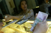 Vàng tăng giá trở lại, USD đi xuống