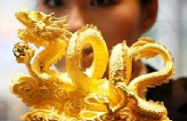 USD hay vàng sẽ là kênh đầu tư 'hời' trong 2012? 