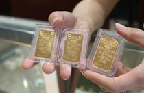 Tiếp đà giảm mạnh, vàng còn 1.635,10 USD/oz