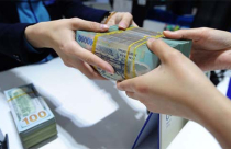 Vì sao tỷ giá USD/VND chưa… bùng?