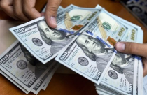 Tỷ giá trung tâm giảm, giá USD trên thị trường tăng
